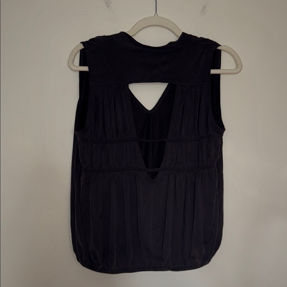 Free People black blouse‎ with cutouts at the back and loose fit